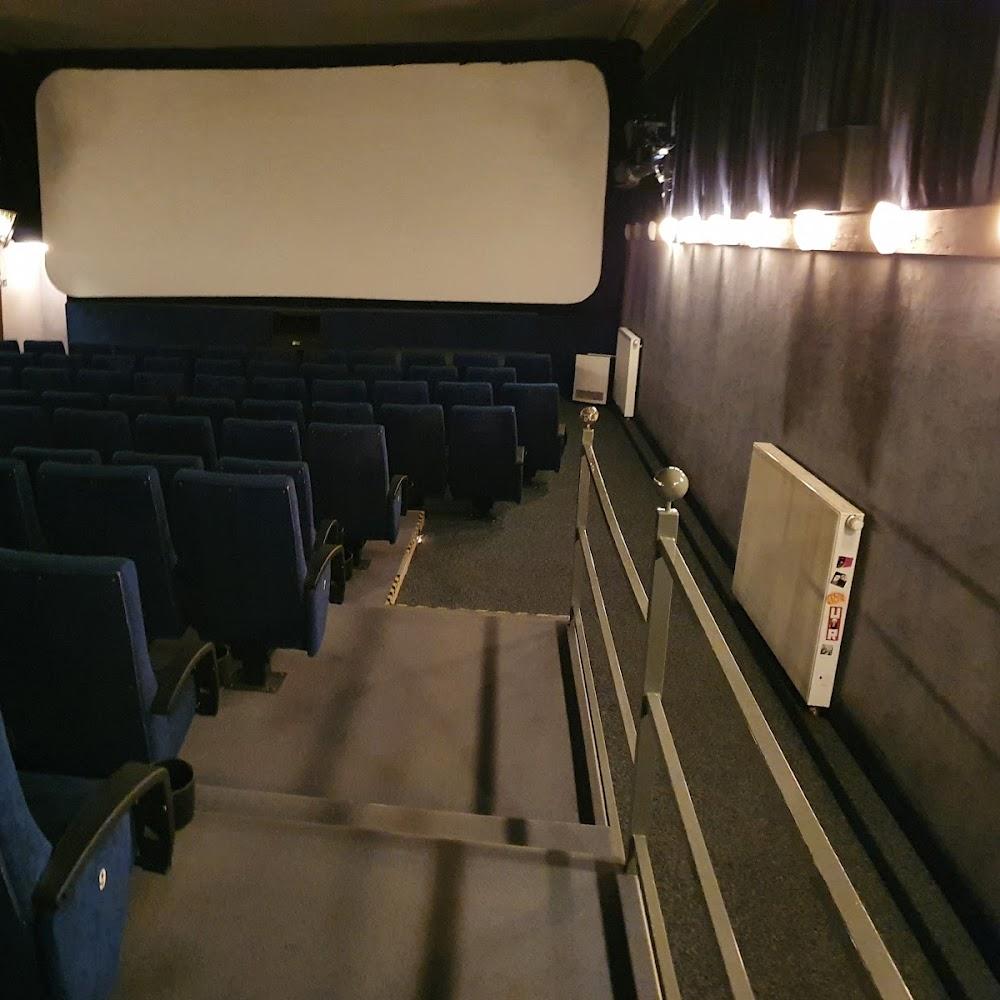 Empty movie theater with blue seats.